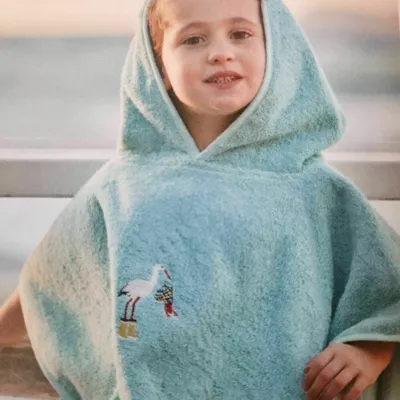 poncho enfant brodé  . col. turquoise.